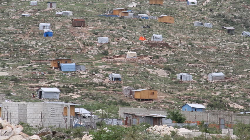 the scattered tin and wood shacks in Haiti