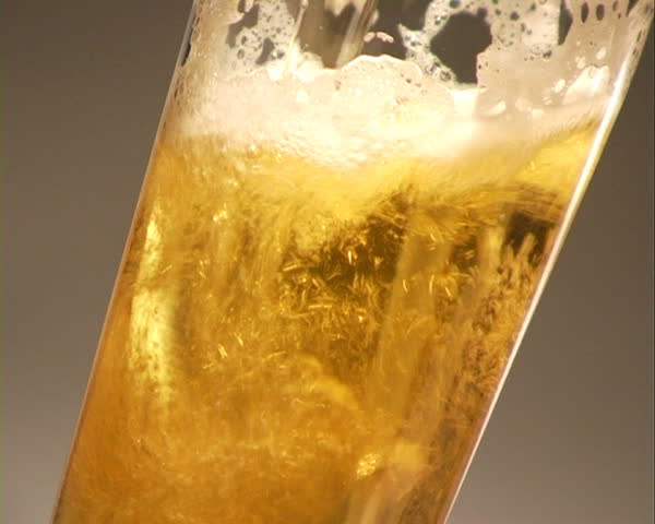 Pouring Beer - Close-Up. Close-up on a glass of beer.