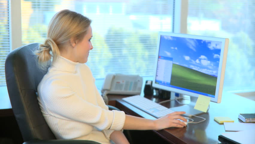 A Professional Woman in an Office with a Coworker