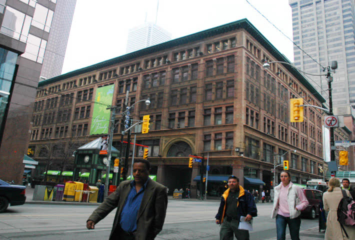 Time lapse. Busy traffic at rush hour in the city. Streetcars, people and cars.