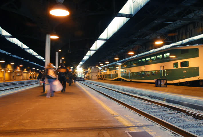 Time lapse. Busy train platform and commuters. 
