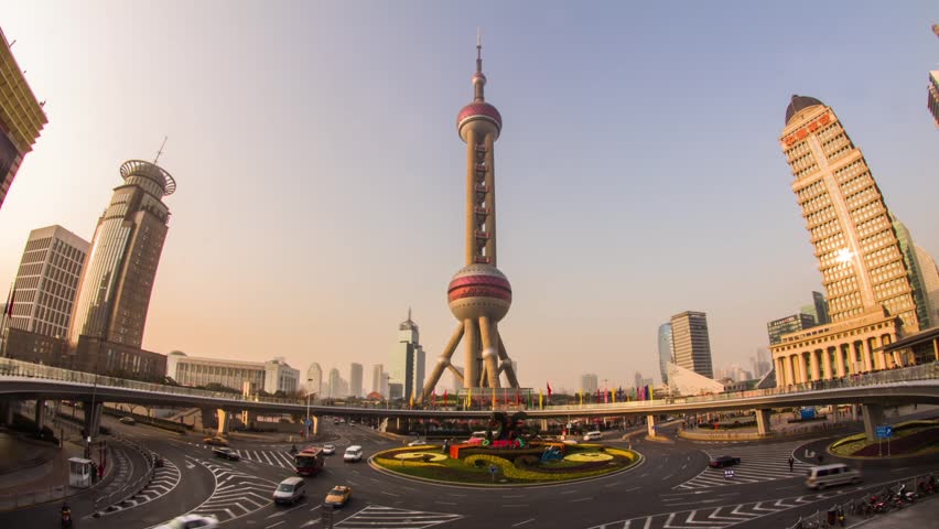 SHANGHAI - CIRCA 2013: Time Lapse of Day view of the East Pearl Tower on the Pedestrian Ring in Pudong, Shanghai, China. With both Crowds traffic and automobile traffic