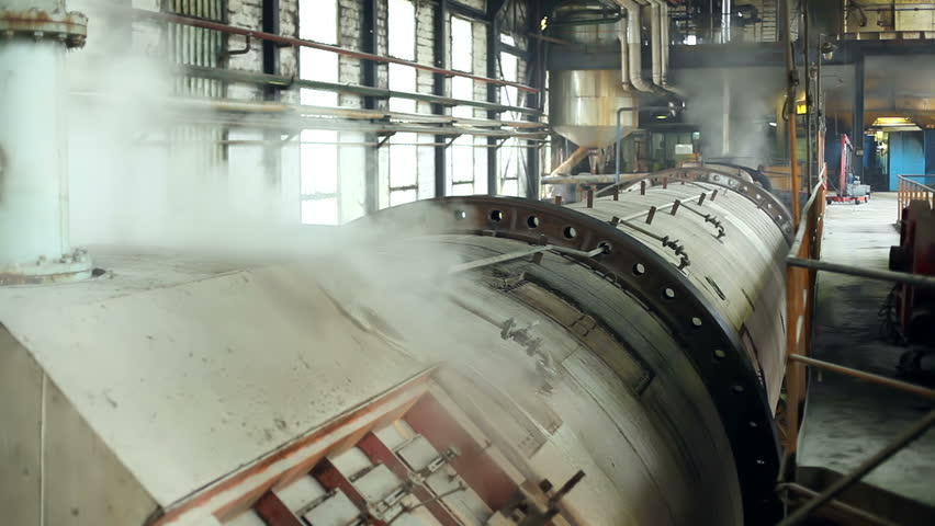 Steam in industrial plants, inside the factory for sugar production. Processing Sugar Beet in Sugar Refinery.
