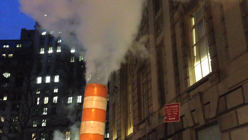 Steam vapor is vented through a red-and-white stack in New York City. The steam system heats, cools and provides power for buildings in Manhattan up to East 89th and West 96th Street