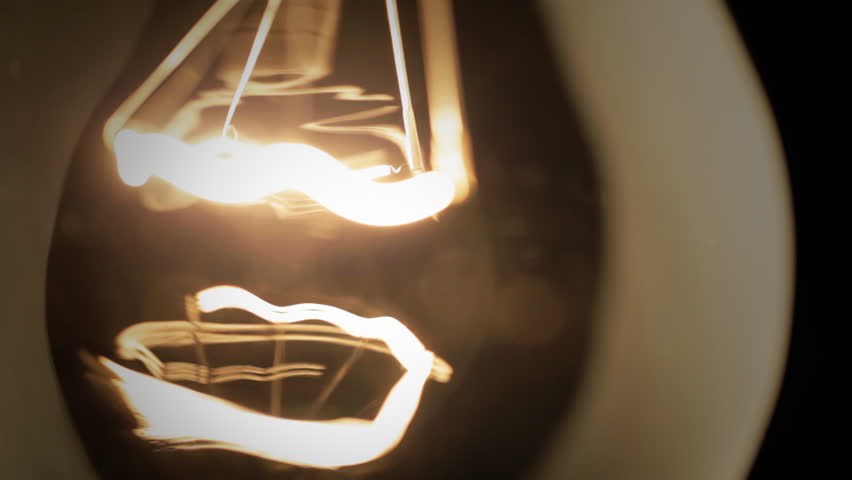 Real light bulb turning on, flickering and turning off