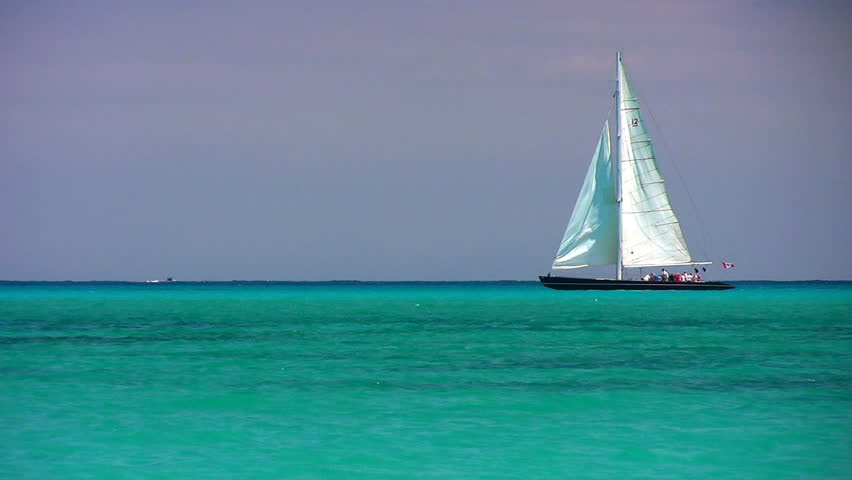A sailboat on the horizon in the beautiful Caribbean ocean