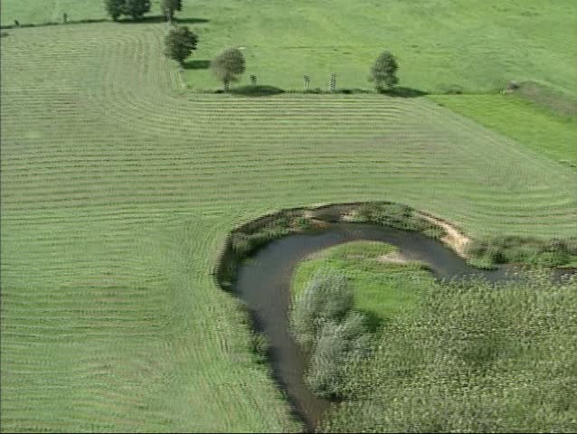 River Geul meanders through Geul valley in the most southern part of Limburg, The Netherlands. Medium shot.