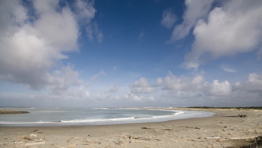 A beach scene with waves and clouds in western Washington State