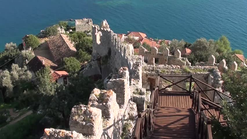 SIMENA, Turkey â March 17, 2013: Old Fortress wall, village and modern stairs