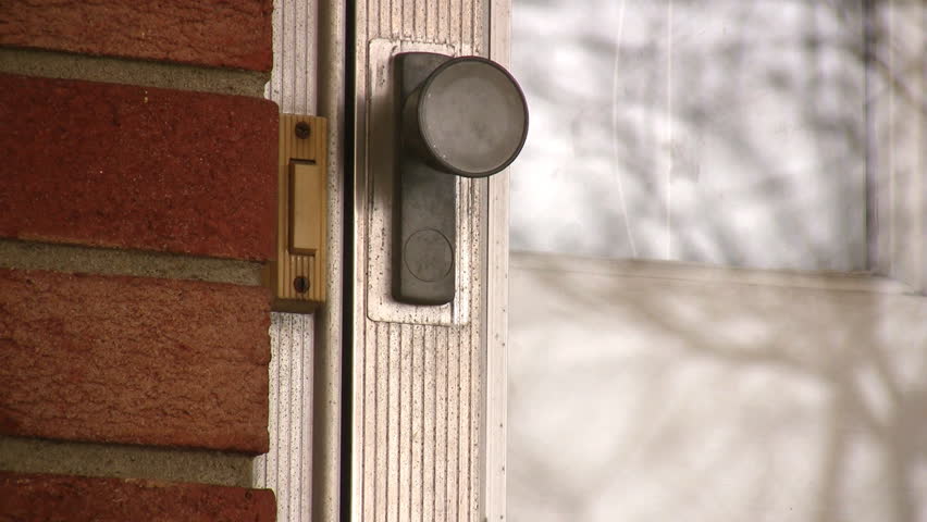 Ringing a door bell.