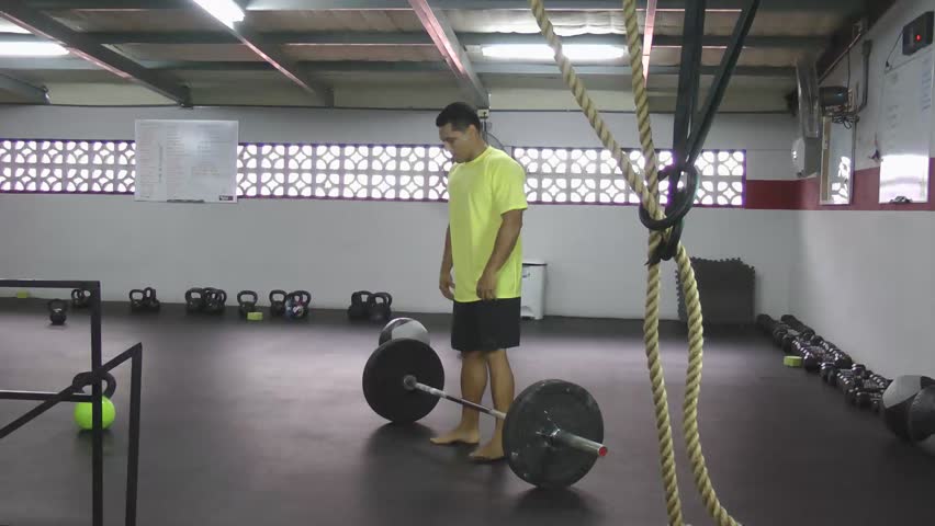 Athlete doing squat clean, clean and jerk, hang clean and jerk, hang clean and press, push press crossfit fitness.