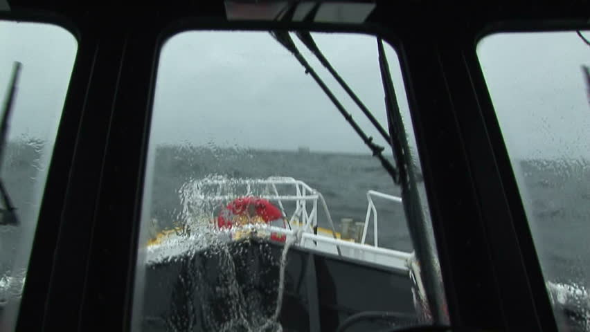 Pilot boat swaying in rough waters on the Columbia River, OR
