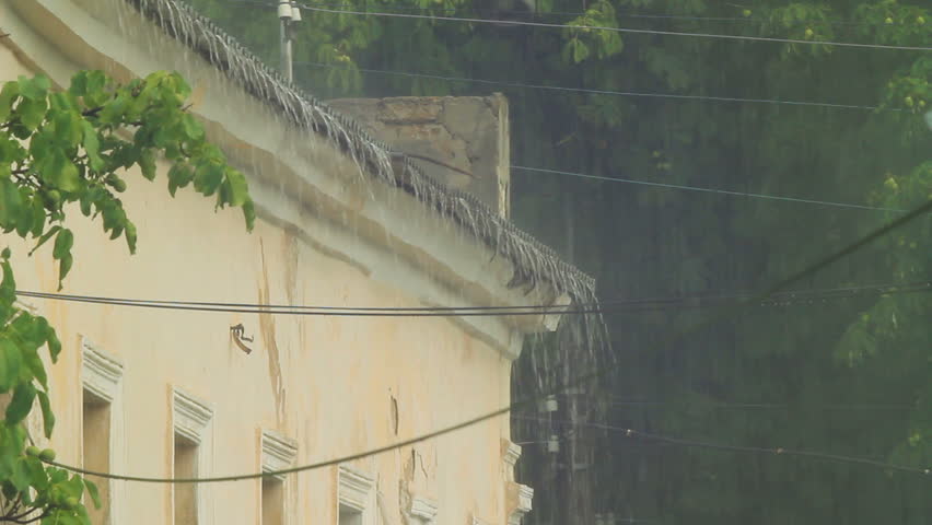 Torrential rain: rainwater is falling from the roof. Original sound included.