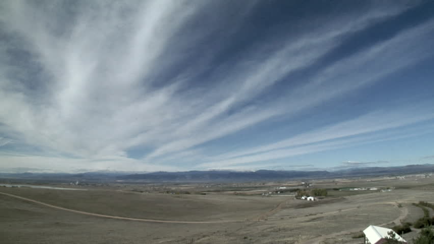 Cirrus Radiatus. Nearly parallel bands of cirrus appear to radiate outwards.