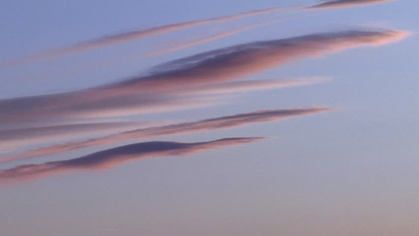 Sunset Streamers. Thin filaments of lenticularis mark mountain wave crests at sunset