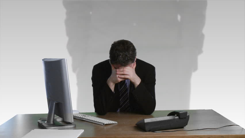 Frustrated business man on a desk