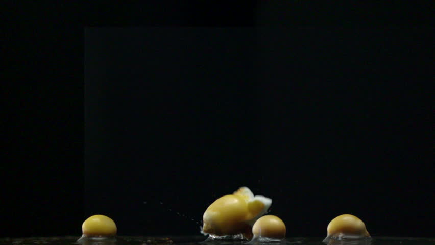 Popcorn popping on black background shooting with high speed camera, phantom flex.
