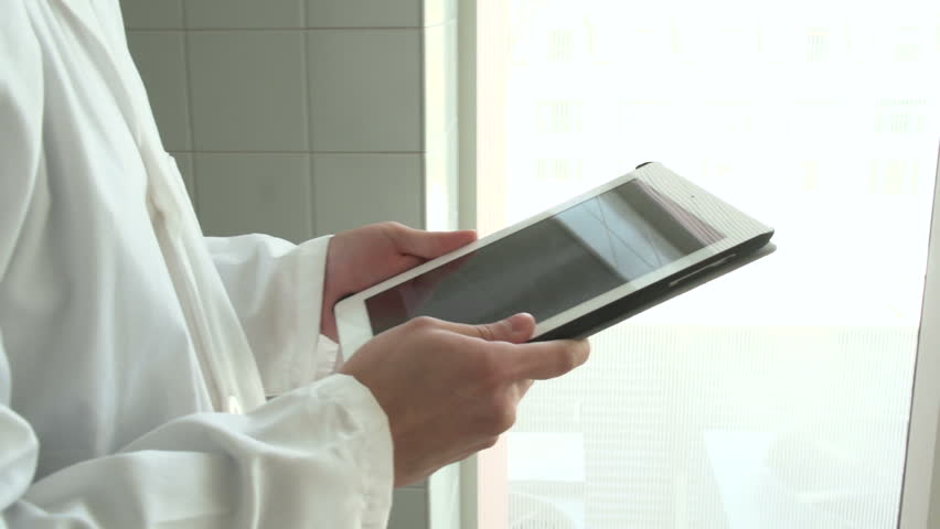 Doctor on his tablet