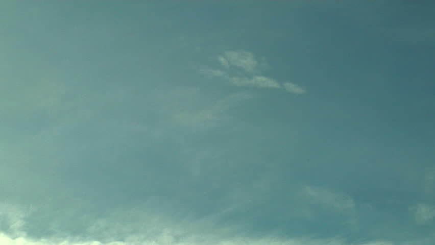 X Marks the Spot. Two jet contrails cross amid the natural cirrus clouds. Complex patterns can be painted in the sky in regions of high commercial aircraft traffic.