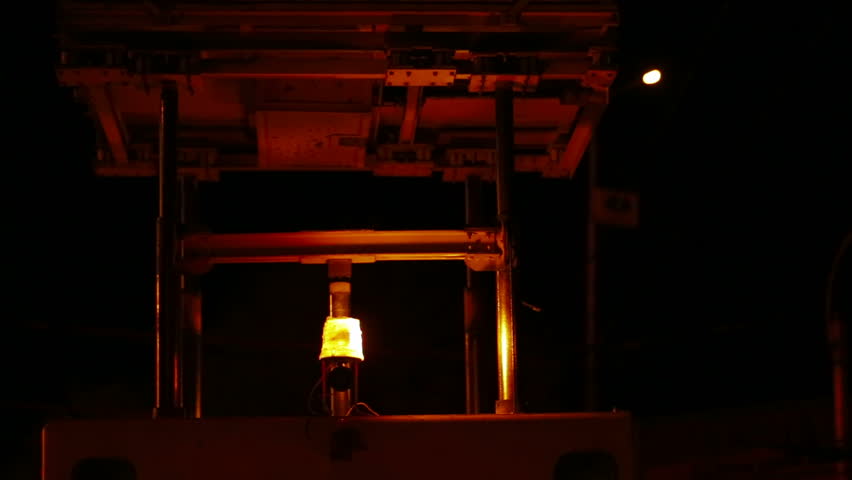 Flashing beacon of a repair truck at night.
Flashing beacon.