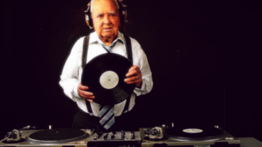a very funky elderly grandpa dj mixing records
