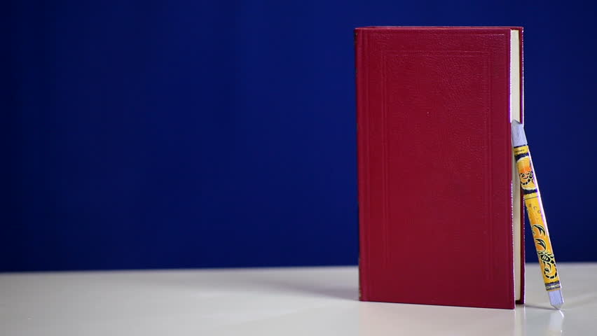 Writing a new book, published in old red style hardcover.