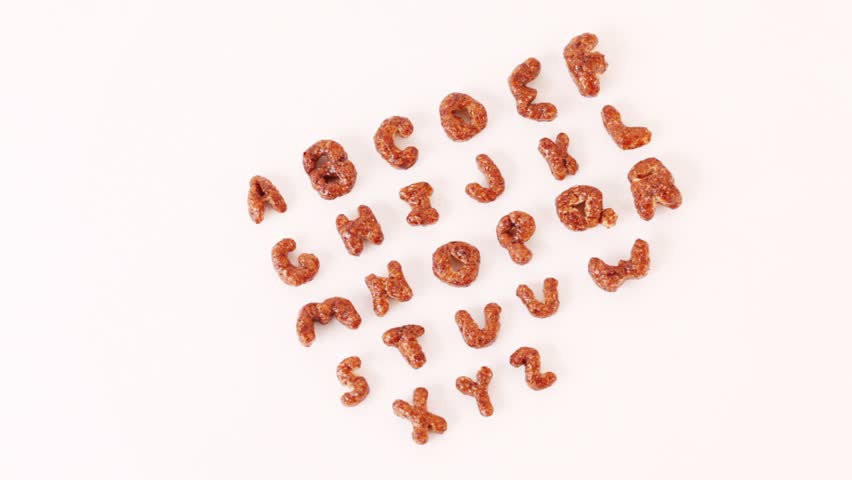 Alphabet letters from cereals on white background