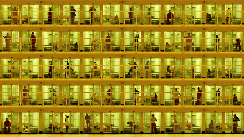 Prisoners serving time in a massive cell block. Composite clip created by putting together multiple videos with still photo elements in After Effects.
