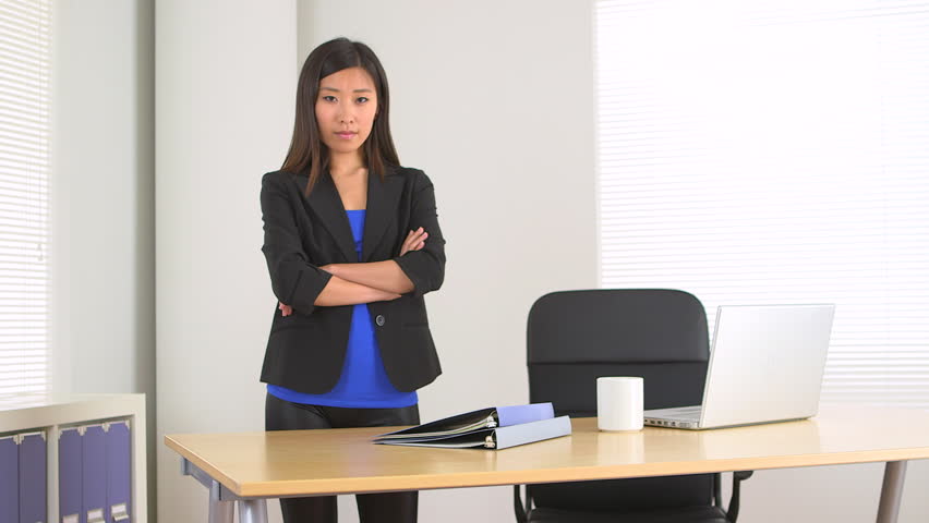 Chinese businesswoman standing in office