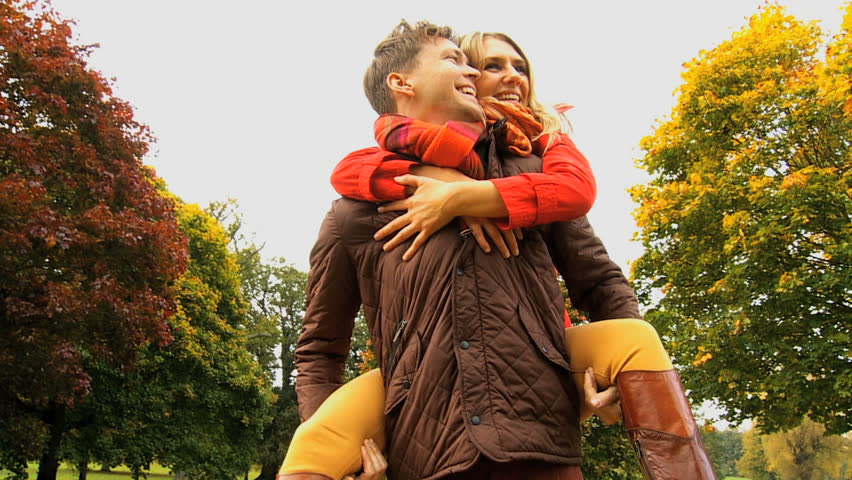 Young couple enjoying healthy outdoor lifestyle cold autumn day