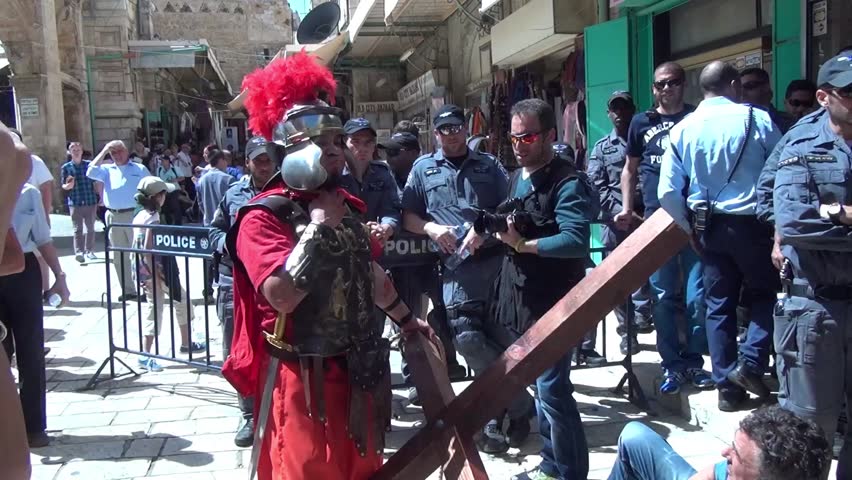 JERUSALEM-MARCH 29: Catholic Holy Friday - a group of actors depicting the crucifixion of Christ near Holy Sepulcher in Old City Jerusalem, Holy Friday March 29, 2013 in Jerusalem, Israel