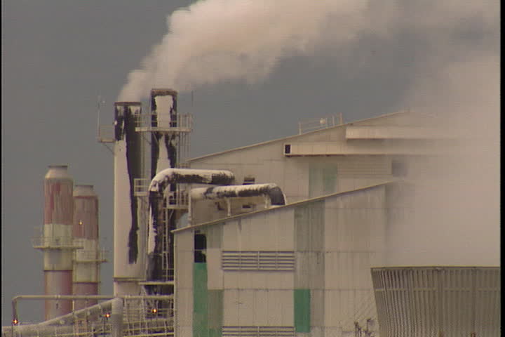 CONVENT, LOUISIANA - CIRCA SEPTEMBER 1999: Smoke spewing from several smokestacks at Convent oil refinery.