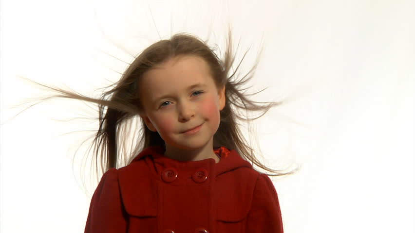 Windswept child - Little girl's long hair being blown around in the wind.