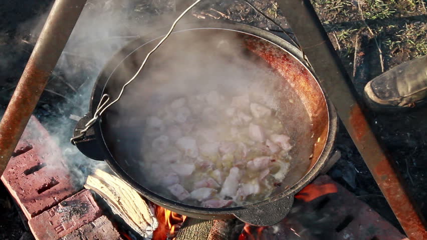 Cooking pilaf. Mix the meat 