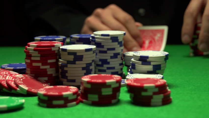 Man raises bet in Texas Hold 'em