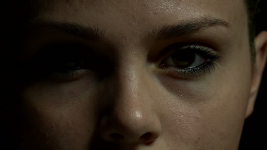 Close up of woman's eyes in color. Experimental lighting.