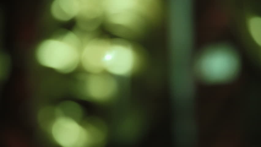 Unhappy Mask in a shopping window, night (focusing)