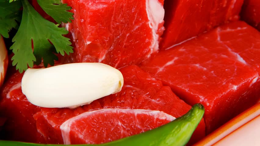 slices of raw fresh beef meat fillet in a ceramic dish with onions and peppers 1920x1080 intro motion slow hidef hd