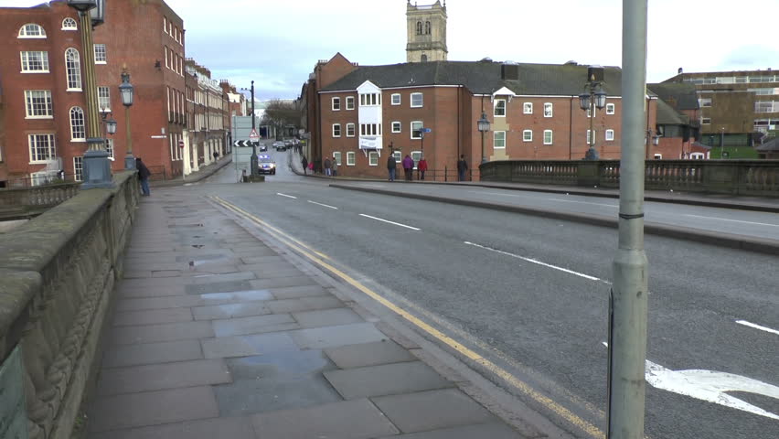 WORCESTER,ENGLAND - DECEMBER 25 2012:aN Ambulance on an Emergency call with sirens and flashing lights on rushing through city streets on December 25,2012 in Worcester,England