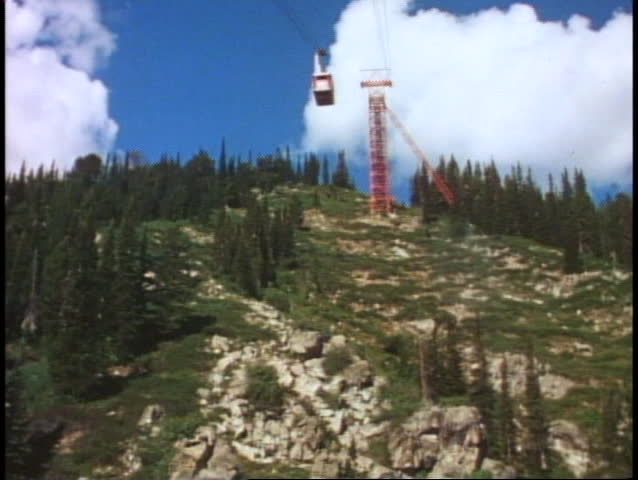 POV from tram, wide shot, passing downward tram, Jackson Hole, Wyoming
