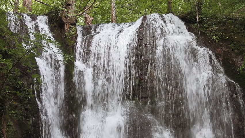 Forest waterfall in springtime  