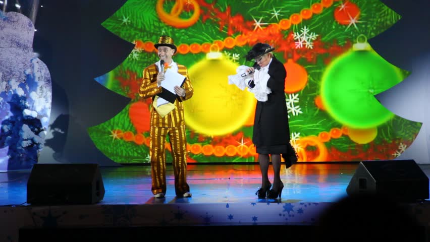 MOSCOW - JAN 04: Actors performing a kids show on stage at Forum Hall New Year masquerade of the Moscow families on Jan 04, 2012, Moscow, Russia