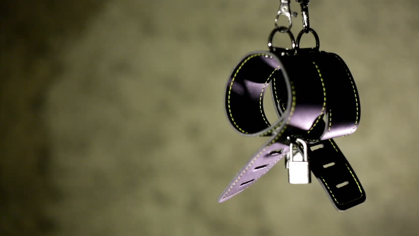 BDSM or dominance and submission for short bondage cuffs for restricting persons freedom, doing with it whatever the dominant partner wants. Quality leather cuffs with locks.
