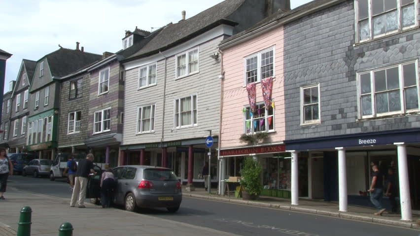 TOTNES, UK - SEPTEMBER 2012 :  A Tudor built covered walkway to shelter dairy products from the sun, now part of the nice independent trading town of Totnes in Devon.