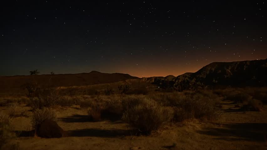 Astrophotography Time Lapse Moonshadow across Desert Horizon Tilt Up