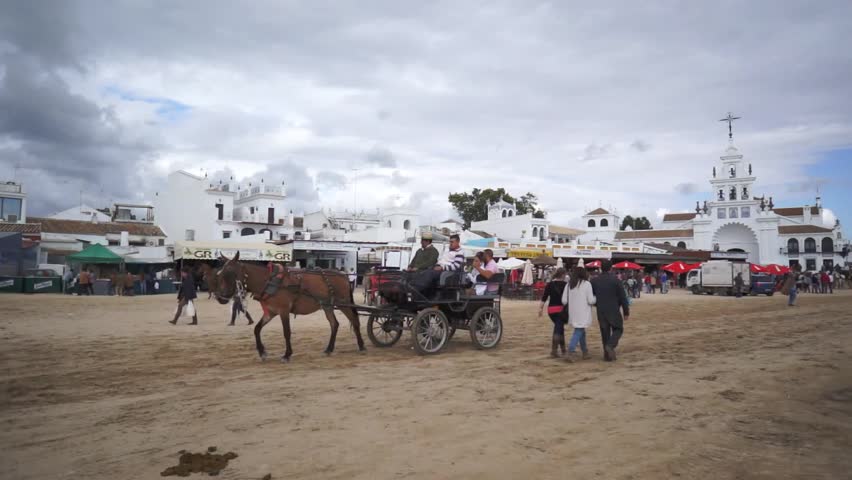 El ROCIO, ANDALUCIA, SPAIN - MAY 19: Pilgrims, people attend to the Sanctuario de Nuestra Senora de El Rocio in one of the most famous religious pilgrimage of Spain. May 19, 2013 in el Rocio, Spain
