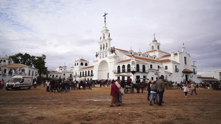 El ROCIO, ANDALUCIA, SPAIN - MAY 19: Pilgrims, people attend to the Sanctuario de Nuestra Senora de El Rocio in one of the most famous religious pilgrimage of Spain. May 19, 2013 in el Rocio, Spain