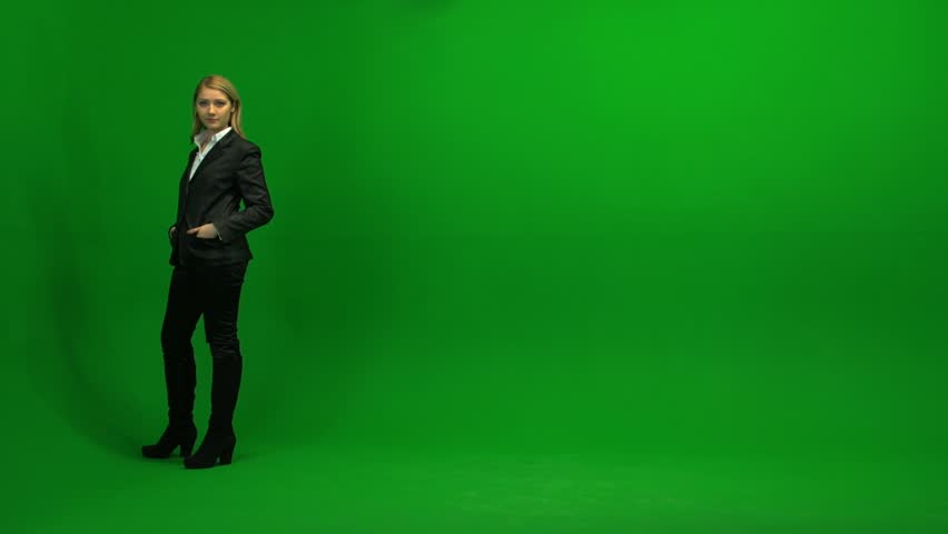 blond women walking trough frame against green screen