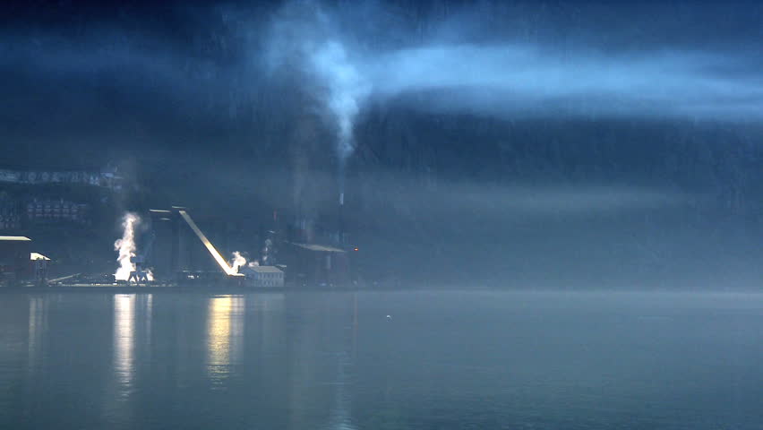Air pollution from oil processing refinery beside a nordic fjord