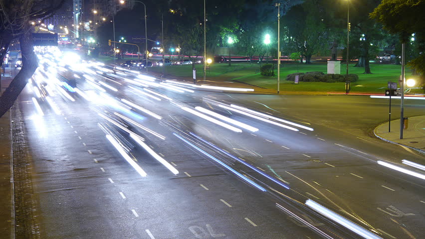 Traffic in the city. Avenue Time-Lapse, Night. Heavy traffic / jam / flowing with blurred motion. Dusk. Dolly in / zoom.
